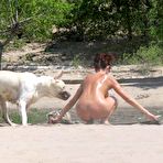 First pic of Young nudists rub oil on each other's naked bodies