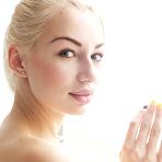 Second pic of While it is freezing outside, Jill raises the temperature inside the room as she sprawls enticingly by the window, the cool morning light kissing her glowing skin.