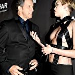 Fourth pic of Miley Cyrus flashing her skin again at amfAR