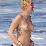 Third pic of Miley Cyrus caught topless on a beach
