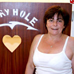 First pic of and then a big black cock came through the hole