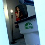 First pic of  She's taking a cigarette break, fully dressed in a tight spandex leotard, silky shiny pantyhose, and tall high heels. @ PantyhoseAddict