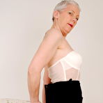 Second pic of Horny mature slut stripping and teasing