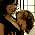 First pic of Older busty milf in stockings seduces younger girl