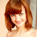 Fourth pic of Red haired hottie Madeline gets naked and shows her wet young pussy @ Ideal Teens Gallery