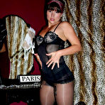 Second pic of Hot MILF shows her curvy legs in black pantyhose and high heels @ PantyhoseAddict