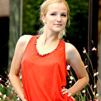 First pic of Good-looking blonde gal poses in a red dress near a pool flaunting her sweet round butt. - TheMetArt.com