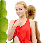 Third pic of Good-looking blonde gal poses in a red dress near a pool flaunting her sweet round butt. - TheMetArt.com