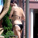 First pic of Paz Vega caught in black bikini on the beach
