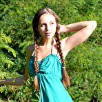 First pic of Amazing chick with two long pigtails taking off clothes and spreading legs on the riverside.