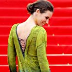 Second pic of Evangeline Lilly posing in short dress shows her long legs at premiere