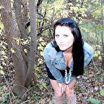 Second pic of Naughty raven babe Freckles exposes her sexy ass as well as her boobs in woods