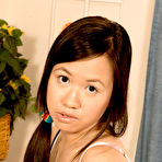 Third pic of Hot Asian teenager Carmina Kai bares off boobs and pinches the erected nipples