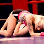 Third pic of Lucy Bell and Paige Fox having a spectacular lesbians scene together as they fuck in the ring 