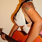 Second pic of Andria Zammi and a Guitar