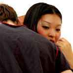 First pic of Nasty Asian babe greeting her lewd boyfriend with ready to action strap-on