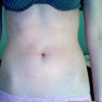 Third pic of Sizzling hot geeky amateur cutie showing off her breasts