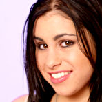 First pic of Busty brunette Whitney Stevens removes her nice panties on the bed and exposes her shaved snatch