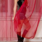 First pic of Brunette teen Little Caprice posing horny naked body against the open window 