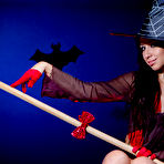 First pic of Amazing long haired witch in a hat and white socks showing shaved quim and fantastic butt.