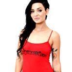 First pic of Inked brunette beauty Aimee Black goes softcore to strip and show her shaved fanny in stockings.