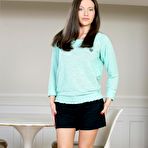 First pic of Dark haired gadget Subil Arch is slowly taking off her top and skirt for viewers