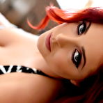 Second pic of Lucy V teasing in her black and white dress wearing stockings | Web Starlets