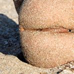 Second pic of Brunette doll Suzanna A is bathing in the sea waves and fooling around in sand