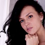 First pic of Baring her corset and thong lovely brunette Verona A demonstrates her tight silky pussy