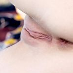 Fourth pic of Angelic blonde teen Aislin shows her hot trimmed pussy in an outdoor softcore session.