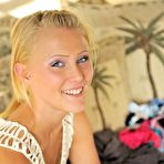Second pic of Blonde sweetie Liz FTV flashes her shaved pussy while walking down the street