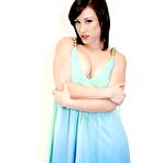 Third pic of Sexy doll Jennifer White turns back to camera, lifts dress up and shows the bun