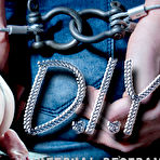 Fourth pic of SexPreviews - Kel Bowie floor bound with metal kabels her pussy and tits exposed