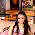 First pic of Charming milf in nylons Aya May is stimulating her clitoris and rubbing nub lips