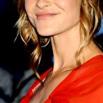 Third pic of Beau Garrett posing in red dress at Tron Legacy premiere