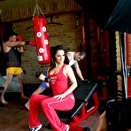 Third pic of Charming Linda Brown gets tag teamed in double penetration scene at the gym