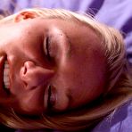 Fourth pic of Kate Frost gets her legs spread for black robotic dildo on a big purple bed