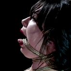 Second pic of SexPreviews - Siouxsie Q is rope bound and dominated in car workshop