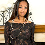 First pic of Busty asian temptress Kina Kai removes her see-thru dress and lingerie at the fireside