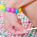 Second pic of Cute Sunny in socks removes her pink panties and fucks herself with lollipop