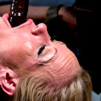 Second pic of Elle Alexandra in a hot police uniform drilling and punishing Simone Sonay hardcore from behind.