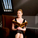 First pic of English redhead Holly Kiss boasts her vintage underwear and opens legs in fully-fashioned nylons