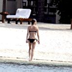 Third pic of Karen Mulder relaxing topless on the beach