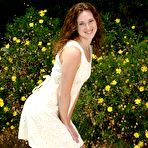 First pic of Curly haired cutie Amber Simpson with small tits and bald pussy strips naked in the sun