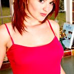 First pic of Red-haired chick next door Fawna Latrisch with hairy pussy bares all on the counter