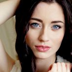 Second pic of Licentious brunette chick Zsanett Tormay is showing her shaved cunt between long slim legs