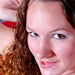 Fourth pic of Holly Day in red dress and white panties drills her hairless pussy with blue dildo