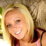 First pic of Smiling blonde kitty Cali Kayden shows her bald pussy in the shadow of a tree