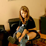 Second pic of Small titted Madison Page with neat pussy strips out of her tight jeans and underwear