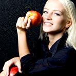 Fourth pic of Sexy blonde Alysha A bends over and approaches her shaved slits to the camera